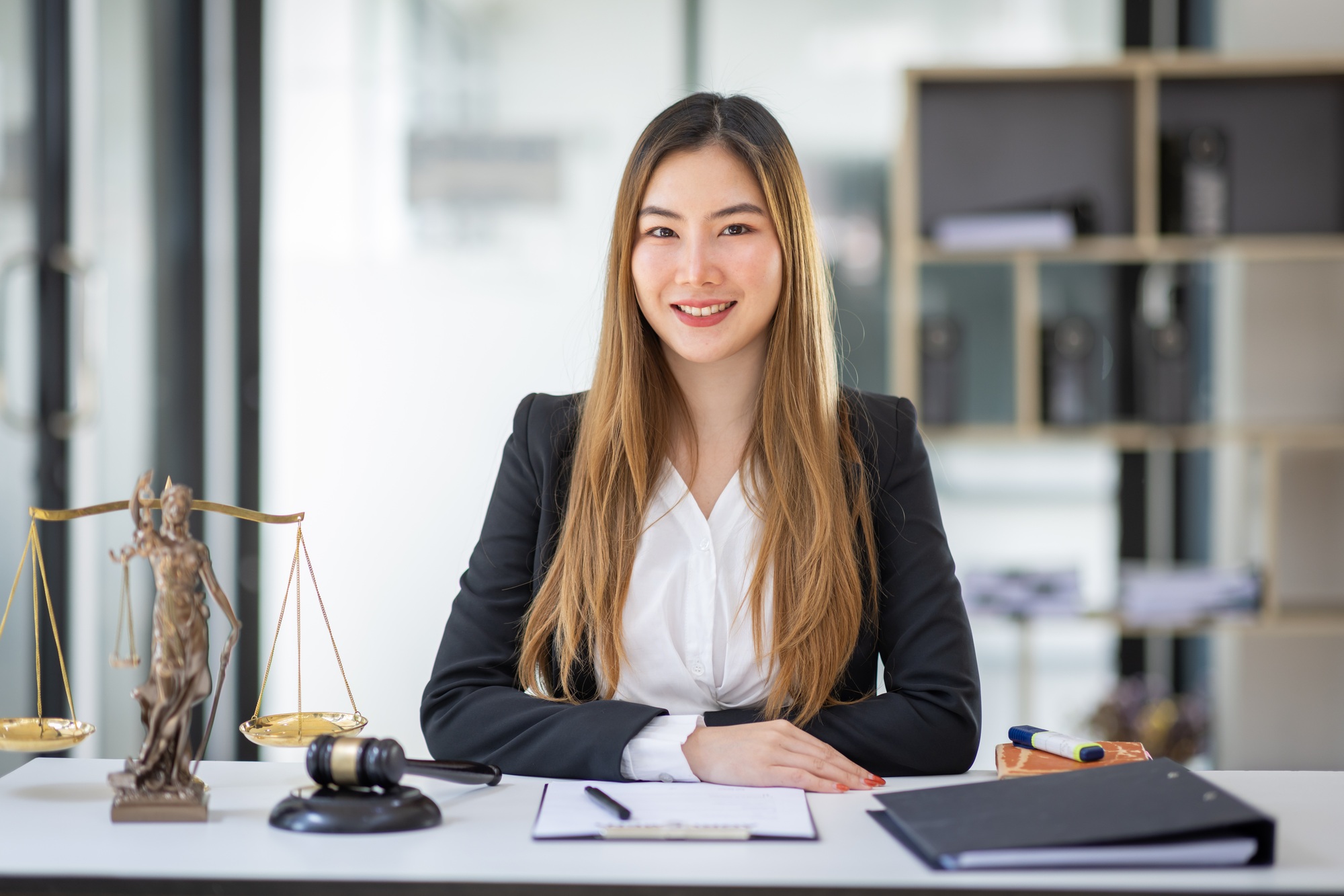 female intelligent law attorney lawyers working at the law firms. Judge gavel with scales of justice