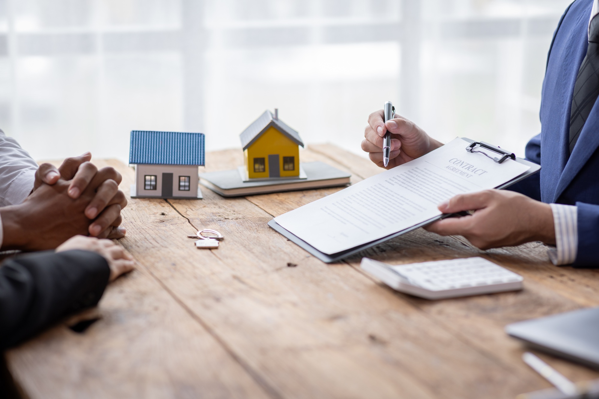 Real estate broker agent presenting and consult to customer to decision making sign insurance form a