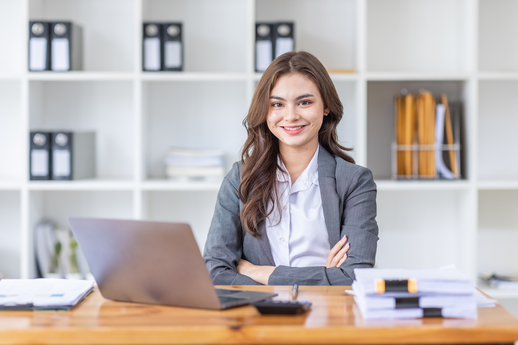 Young business Asian woman Accounting using calculating income-expenditure and analyzing real estate